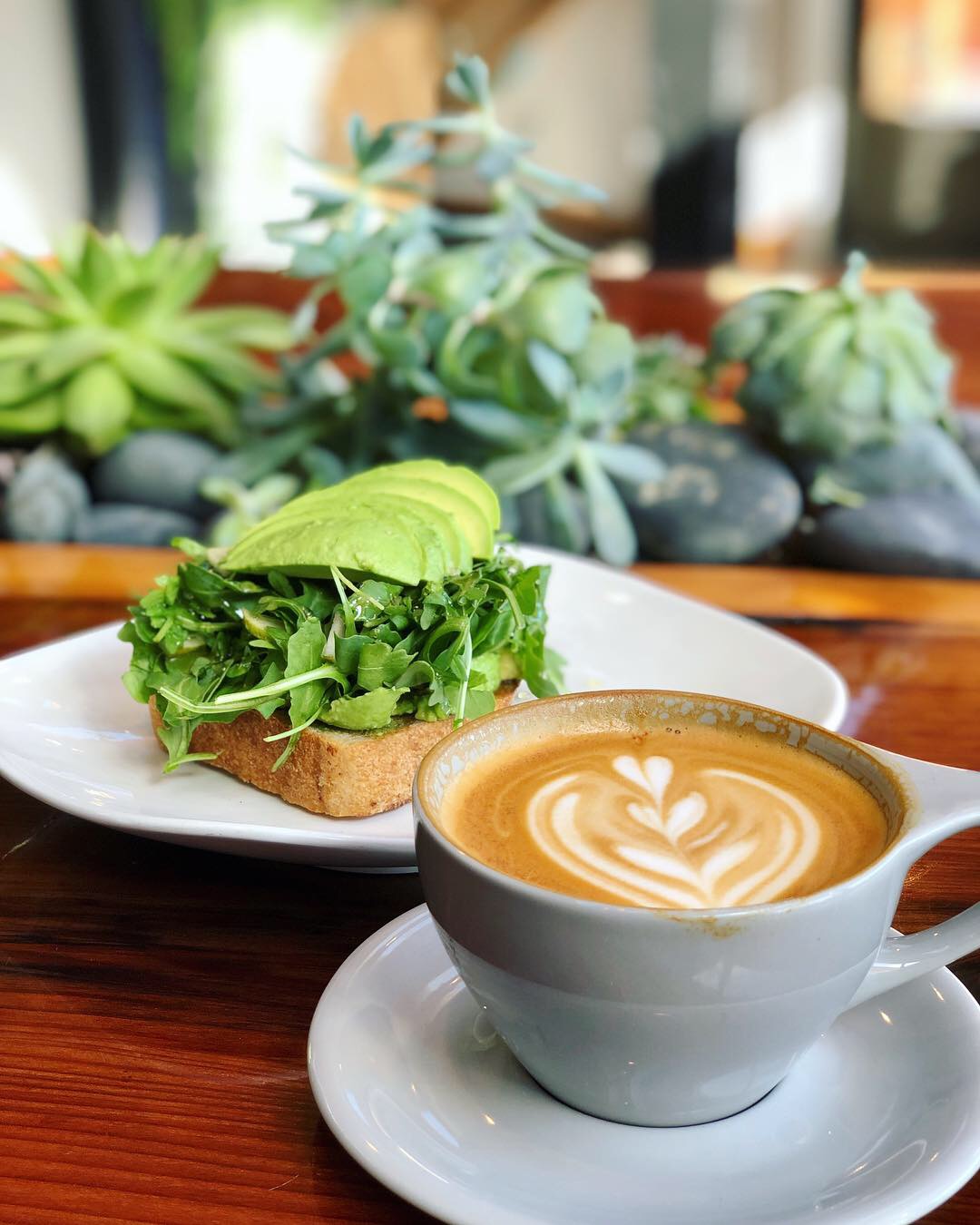 Latte and avocado toast at 11th Hour Coffee